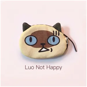 Macro shot of plush Siamese cat coin purse with blue eyes and zipper detail