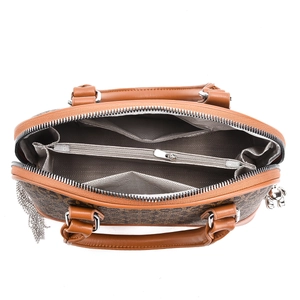 Interior detail of vintage handbag showing center zipper pocket and herringbone lining