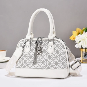 Elegant white shell crossbody bag with geometric logo pattern and wide shoulder strap