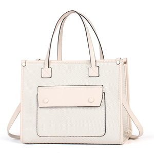 Minimalist beige tote bag with large front pocket and slim shoulder straps for women