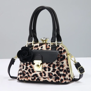 Detail of leopard print crossbody bag with black rose decor and crystal top lock