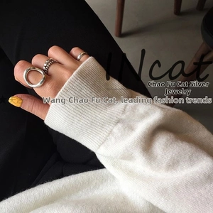 Minimalist S925 sterling silver ring set featuring open geometric circles on a model