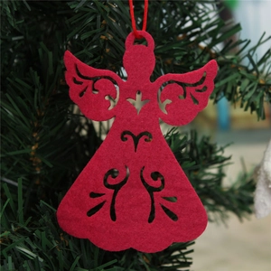 Red felt angel ornament with laser-cut heart detail hanging on a green Christmas tree