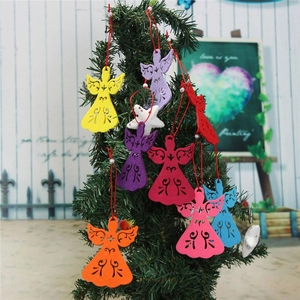 Colorful felt angel Christmas ornaments hanging on a tree branch with red string