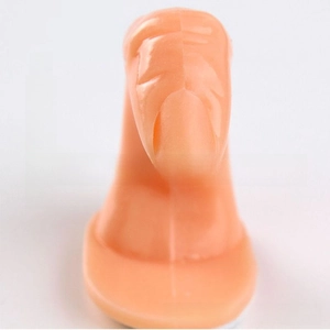 Detailed view of flesh pink manicure practice finger model B with built-in nail