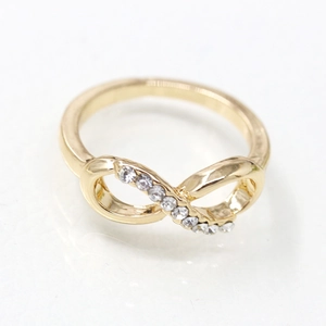 Gold-plated infinity ring featuring sparkling rhinestones on a minimalist band for women
