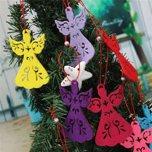 Detail of laser-cut angel felt ornaments on Christmas tree with colorful hanging ropes