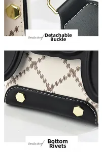 Détails du fermoir doré amovible et des rivets de fond sur sac noir et blanc