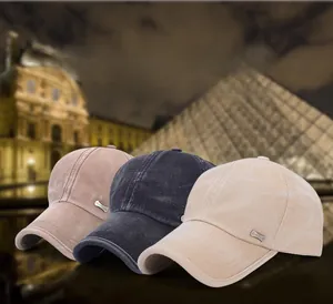 Detail of classic washed cotton baseball caps with metallic plates in various colors