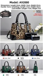 Detailed view of leopard print handbag set including tote bag, pouch, and card holder
