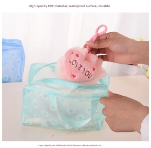 Detail of floral PVC waterproof toiletry bag with zipper and handle holding bath sponge