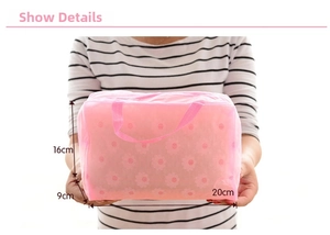 Pink translucent floral PVC wash bag with daisy pattern and sturdy top handle