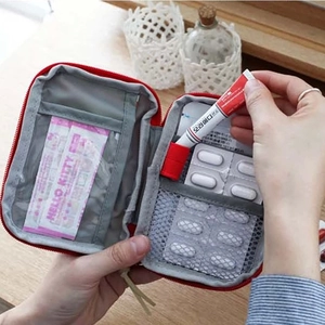 Portable mini medical first aid kit bag with internal organizers for outdoor travel