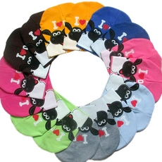 Macro shot of colorful knitted baby hats featuring a cute star and sheep cartoon pattern