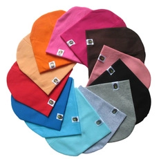 Detailed view of knitted baby beanies displayed in twelve different vibrant colors