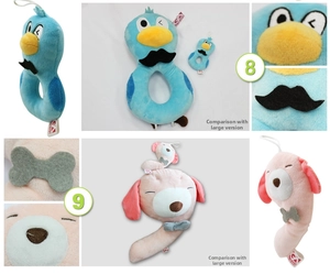 Close-up of number-shaped plush rattles featuring detailed embroidery and soft texture