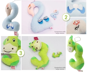 Detail of plush number toys showing embroidery and size comparison for baby education