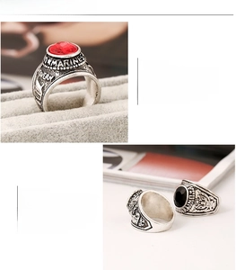 Macro shot of retro military men's ring featuring ruby setting and eagle emblem engraving