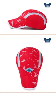 Detail of red quick-dry kids baseball cap with mesh panels and airplane embroidery