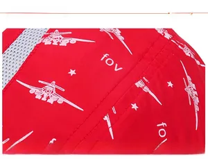 Detail of red quick-dry fabric showing precise stitching and white airplane star patterns