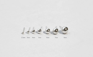 Detailed view of silver ball stud earrings in sizes 2.5mm to 8mm with mirror finish