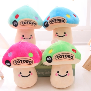 Detail of four colorful mushroom plushies with polka dots and suction cup strings