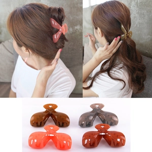 Polka dot hair claw clips in pink, brown, grey and orange colors for long hair