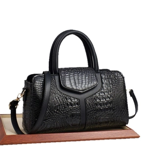 Elegant black crocodile pattern handbag with top handles and adjustable shoulder strap