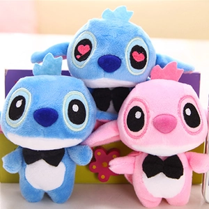 Close-up of cute Stitch and Angel plush keychain toys with soft velvet texture