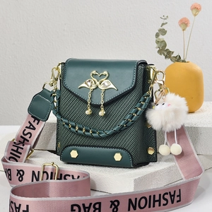 Deep green leather crossbody bag with golden swan heart clasp and woven texture