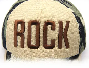 Detailed view of 3D embroidered ROCK text on khaki canvas and camouflage mesh cap