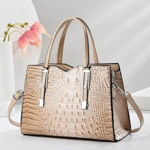 Chic beige crocodile embossed leather handbag with top handles and silver hardware