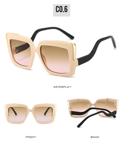 Detailed views of oversized square cream sunglasses with unique wavy black temples
