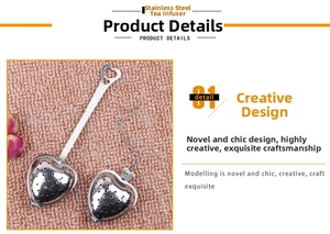 Close-up of heart-shaped stainless steel tea infusers with handle and chain detailing
