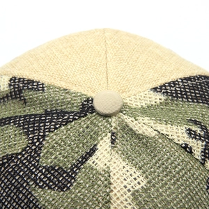 Top view of camouflage baseball cap with beige fabric panels and textured stitch detail
