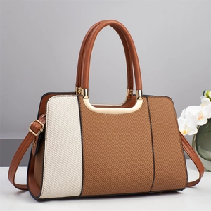Contrast color woven tote bag with metallic handles and adjustable shoulder strap