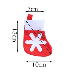 Mini red felt Christmas stocking with snowflake pattern and detailed size dimensions