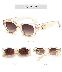 Detailed views of tea brown oval sunglasses with gold bird and sword temple accents