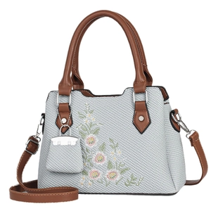 Elegant grey embroidered handbag with floral patterns and brown leather straps for women