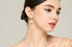 Model wearing elegant long opal pearl tassel drop earrings with silver hooks for women