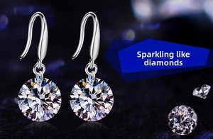 Detail of 8mm round brilliant cut silver drop earrings with elegant ear wire design