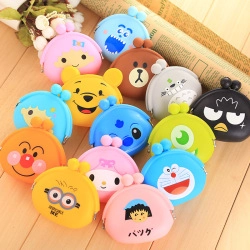 Variety of colorful silicone cartoon mini coin purses with metal clasp on wooden desk