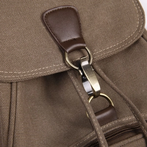 Vintage canvas backpack with leather straps and bronze metal hooks for travel