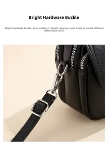 Λεπτομέρεια από ασημί μεταλλικό γάντζο και μαύρο δέρμα με υφή λίτσι σε τσάντα