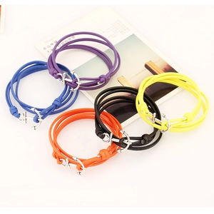 Close-up of multi-layer leather anchor bracelets in blue, purple, orange, black and yellow