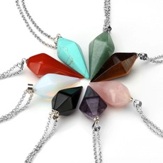 Macro view of eight conical natural stone pendants with silver chains on white background