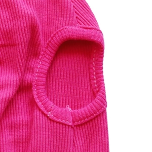 Detailed close-up of rose red ribbed knit pet vest showing quality stitching and fabric