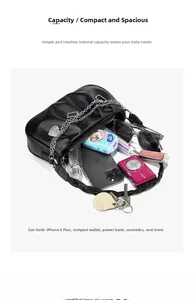 Top view of black ruched tote bag showing capacity for phone, camera and sunglasses