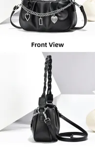 Front view of black pleated handbag with silver chain and heart-shaped pendants