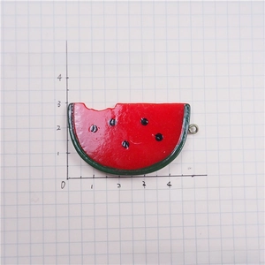 Detail of resin watermelon pendant with a bite shape and metal ring for DIY jewelry
